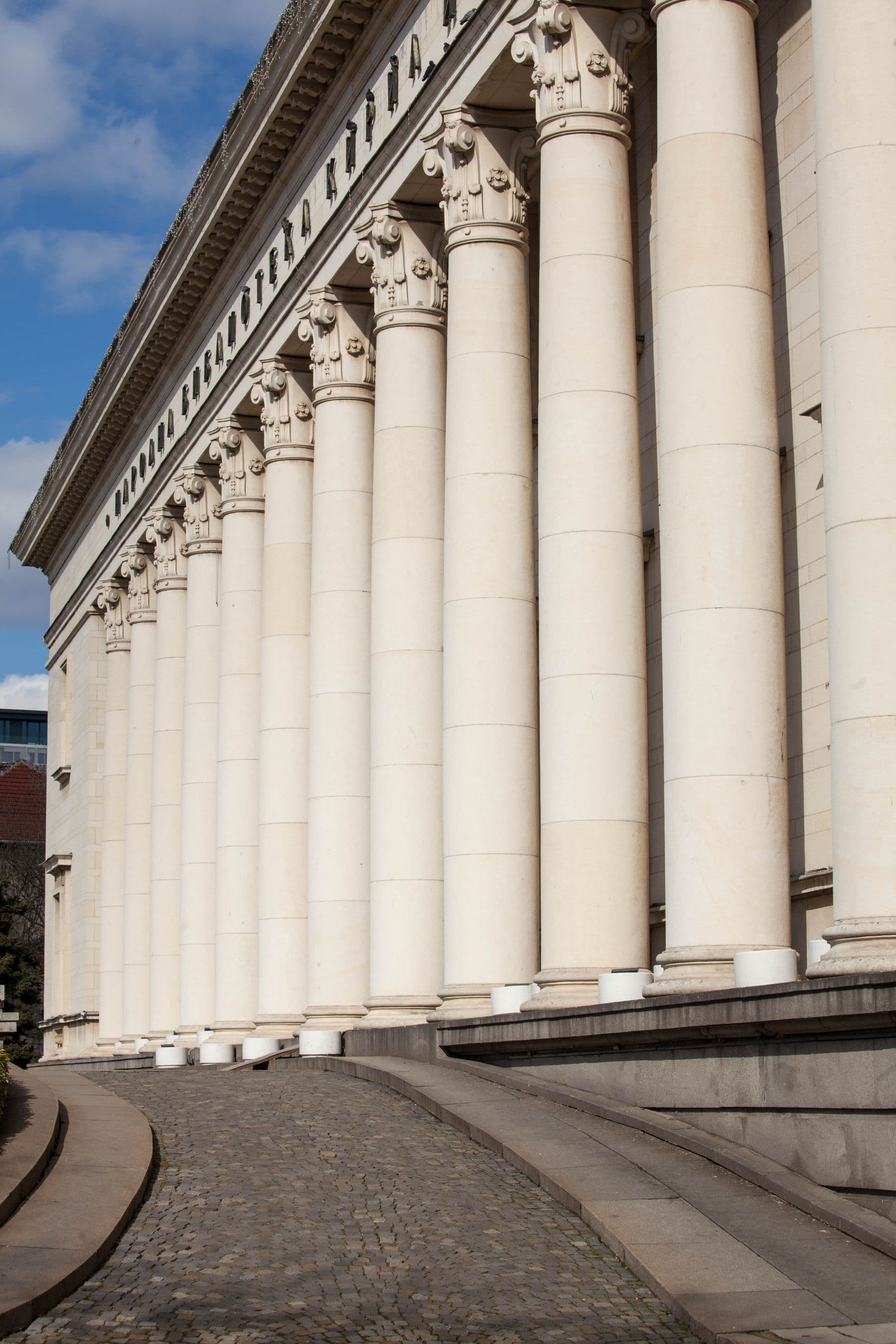 The stone colonnade of a neoclassical building