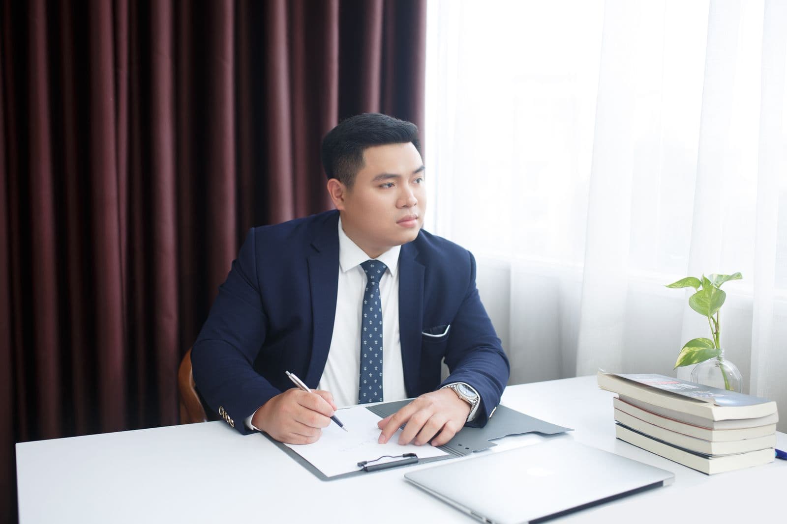 An officer writing up a request at his desk